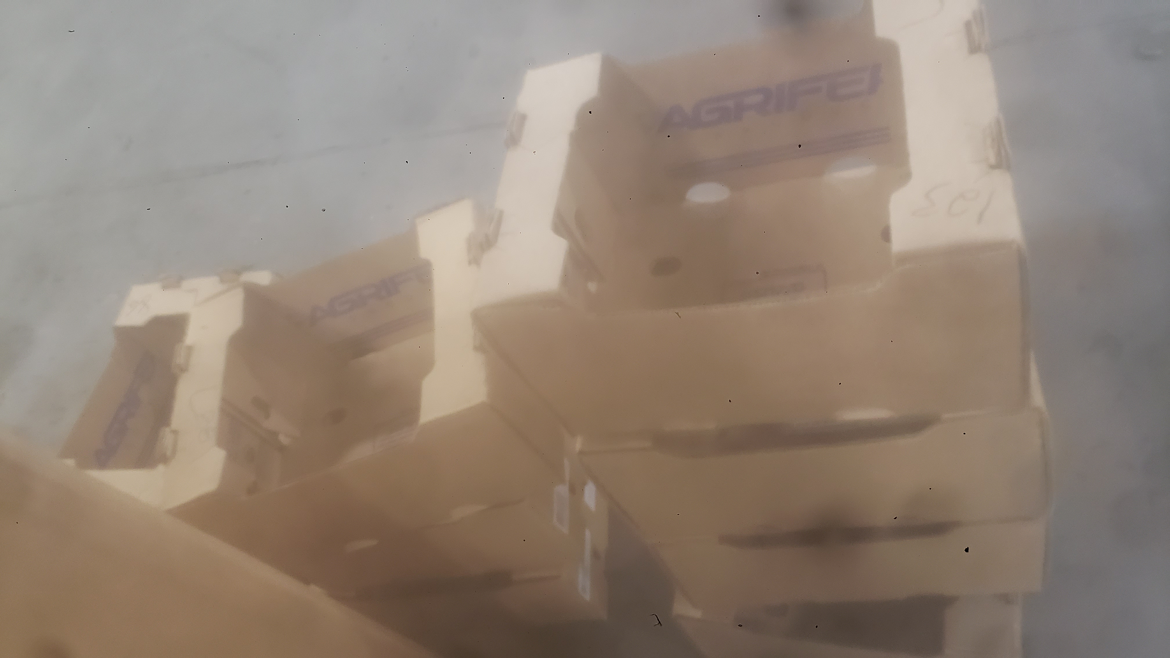 Stacked rows of agricultural cardboard trays.